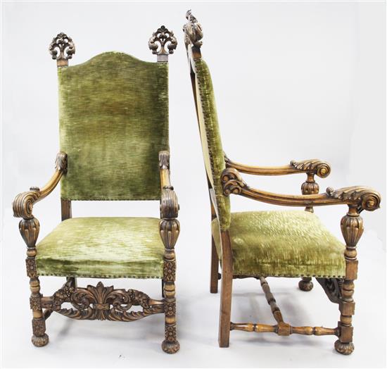 A pair of 17th century style Flemish carved beech high back open armchairs,